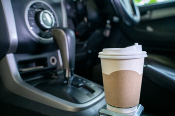 paper coffee cup in the car, traveler's hot coffee