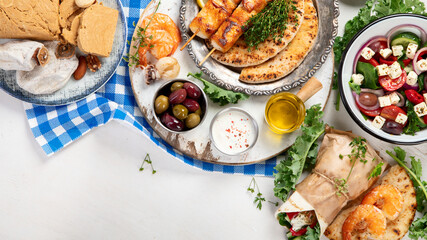 Greek cuisine dishes on neutral background.