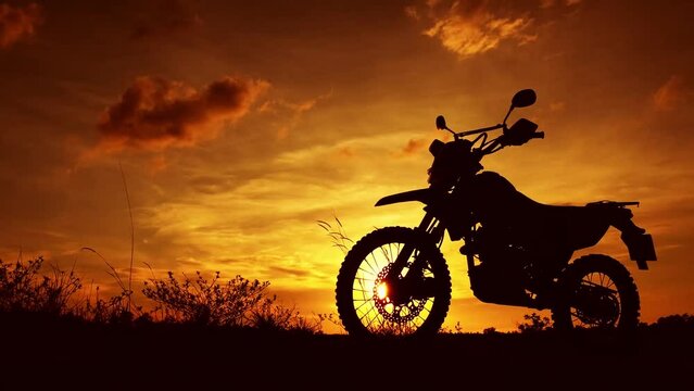 Off-road motorbike extreme cornering. Motorcyclist at sunset near the river. Extreme motocross bike