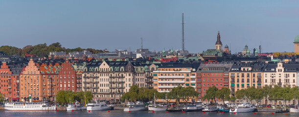 Bay view over the pier Norr Mälarstrand with steam boats apartment and office buildings over the...