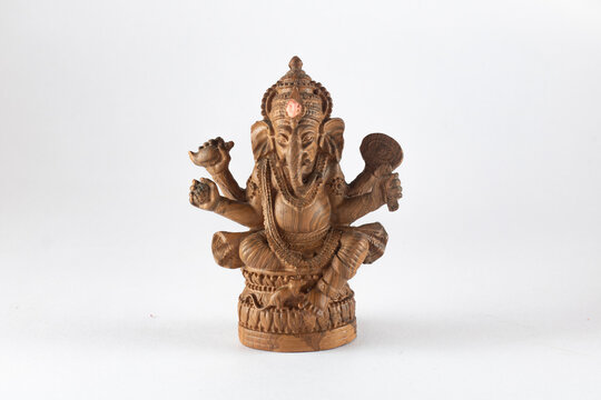 Ganesh, resin texture, brown wood grain on white background, horizontal image.