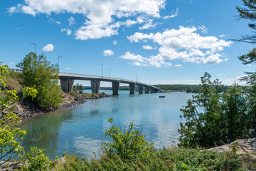 Fototapeta na wymiar St. Joseph's Island Bridge crosses St. Mary's river to cover the gap between the Canadian mainland near Sault Ste. Marie, Ontario and the island.