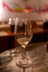 Wine tasting in underground cellars caves of French wine domain in Puligny-Motrachet village, Burgundy, France