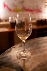 Wine tasting in underground cellars caves of French wine domain in Puligny-Motrachet village, Burgundy, France
