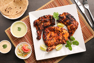 Thandoori chicken , Arabian spicy food tandoori whole chicken Bengaluru, India . Platter served...