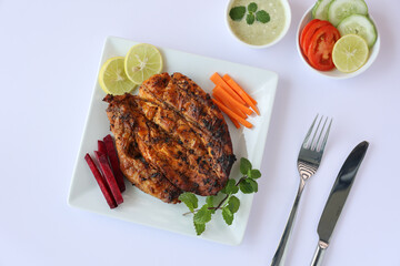 Thandoori chicken , Arabian spicy food tandoori whole chicken Bengaluru, India . Platter served with salads. Al Faham Charcoal Grilled Chicken in India .