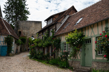 One of most beautiful french villages, Gerberoy - small historical village with half-timbered houses and colorful roses flowers, France