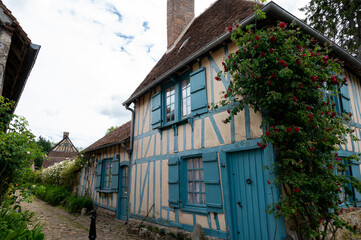 One of most beautiful french villages, Gerberoy - small historical village with half-timbered houses and colorful roses flowers, France