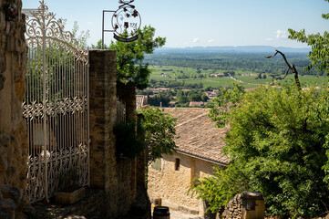 VIew on medieval buildings in sunny day, vacation destination wine making village Chateauneuf-du-pape in Provence, France
