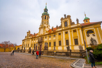 Obraz premium Loreto Sanctuary near Novy Svet , Pilgrimage site with the Baroque Church near Prague castle during winter . Prague , Czech : December 12, 2019