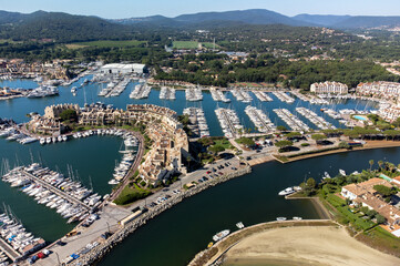 Obraz premium Aerial view on Gulf of Saint-Tropez, sail boats, houses of Port Grimaud and Port Cogolin, summer vacation in Provence, France