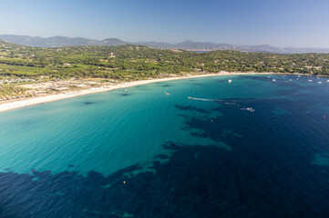 Aerial view of legendary Pampelonne beach near Saint-Tropez, summer vacation on white sandy beaches...