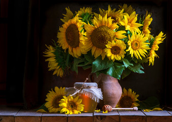 beautiful yellow Sunflower still life bouquet  in a clay jug ceramic rustic style oil honey Dark photo background wooden table Vintage. Retro. low key Autumn flowers.