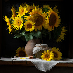beautiful yellow Sunflower still life bouquet  in a clay jug ceramic rustic style oil honey Dark photo background wooden table Vintage. Retro. low key Autumn flowers. © Victoria Moloman