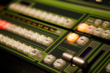 close up of tv switcher machine digital analogue broadcast podcast buttons live