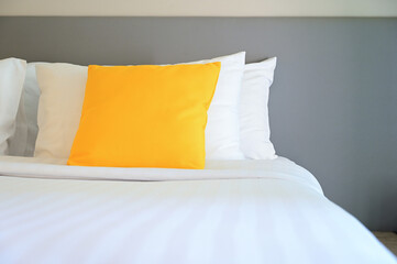 yellow pillow on white bed, interior design