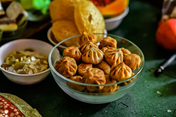 Indian Traditional Sweets For Holidays and Festivals. Modak in glass bowl. Fresh Happy Colors. Worship With Favourit Food of Main Hindu God and Goddess. Colorful Food Wallpaper 