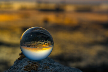 The reflection on crystal ball during sunset