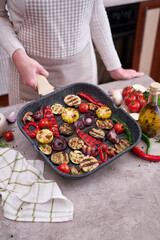 Grilled vegetables on grill pan at domestic kitchen