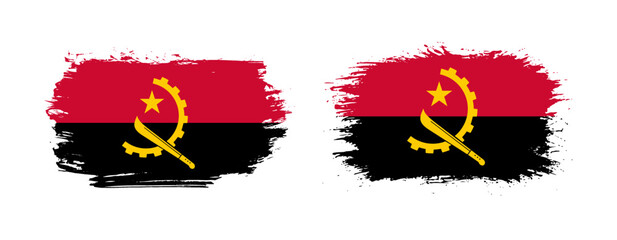Set of two grunge brush flag of Angola on solid background
