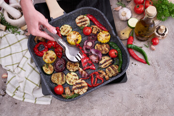 Grilled vegetables on grill pan at domestic kitchen