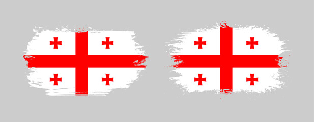 Set of two grunge brush flag of Georgia on solid background