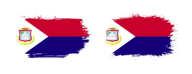 Set of two grunge brush flag of Saint Martin on solid background