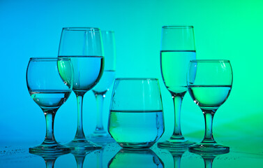 Wine glasses with neon multicolor light