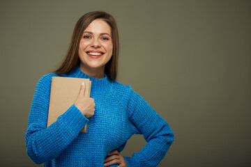 Student or teacher woman with book wearing warm winter clothes. isolated female portrait.