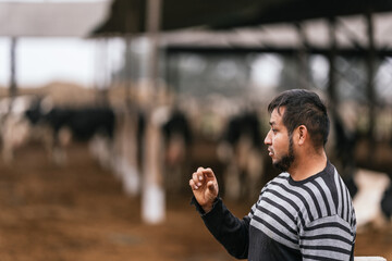 Profile of a latin male farmer in a stable