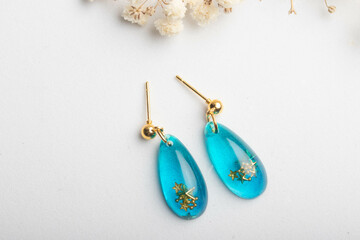 Heart-shaped earrings made of resin, handmade jewelry.