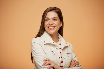 Smiling woman in white jacket looking away. isoalted portrait on yellow background.