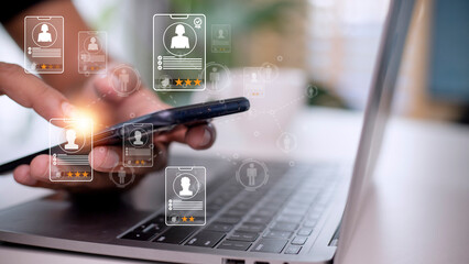 Online recruitment application specialist search service concept with virtual cards with rating and profile information on a smartphone in hand.