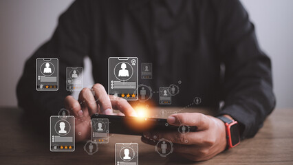 Online recruitment application specialist search service concept with virtual cards with rating and profile information on a smartphone in hand.