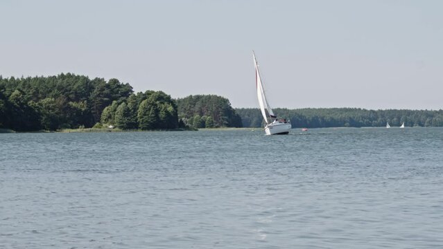 Yacht sailing On Wdzydze Lake In Poland - wide, static