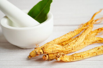 Ginseng roots and green leaf, healthy food.