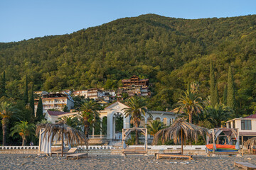 An old colonnade on the embankment with a beach in Gagra (Abkhazia)