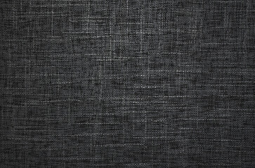 Close-up of black fabric texture background. Natural textile surface.