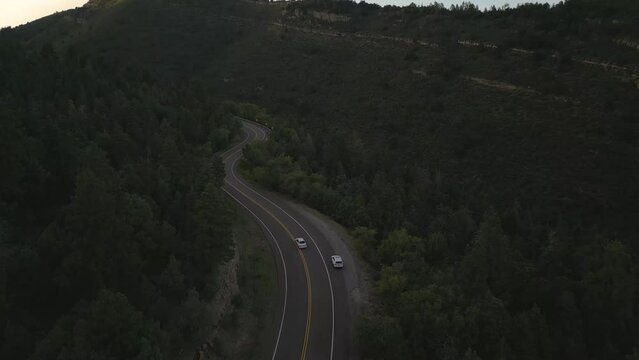 Two White Cars on Road in Forest of Sandia Mountains, New Mexico USA, Drone Aerial View