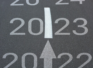 New start of the new year 2023. Starting to new year. 2023 written on the road	