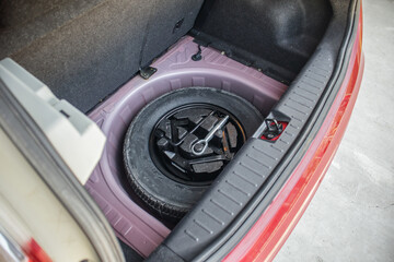 Fototapeta na wymiar spare tire in the modern compact car
