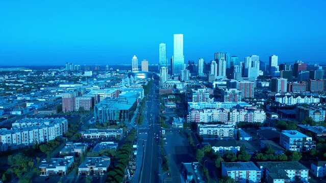 parallax flyover aerial 104 Ave top view drone quiet street overlooking low rise residential buildings on route to the downtown city mirrored glass windows Rogers oil drop oilers building summer 4k60