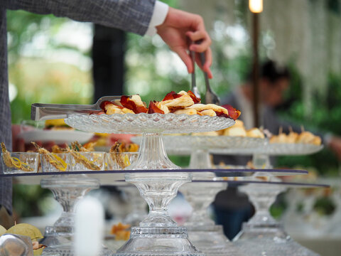 people self serve catering buffet finger food indoor in luxury location in Italy