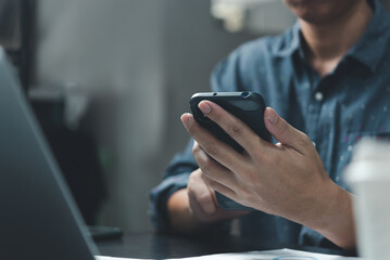 Businessman using smartphone marketing laptop computer business network manager. man using notebook internet online technology communication.
