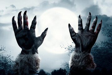 Werewolf hand with a full moon
