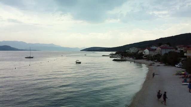 Aerial Drone Footage Across a Croatian Beach on A Couldy Morning.