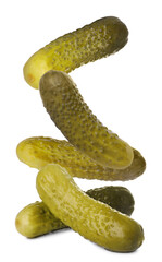 Tasty pickled cucumbers falling on white background