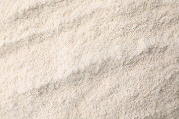 Heap of quinoa flour as background, closeup