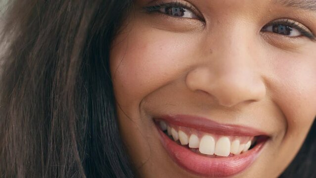 Portrait of face, smile and beauty of a Brazilian woman with perfect teeth for dental health model smiling and glowing with happiness. Closeup zoom of female with beautiful skin and positive attitude