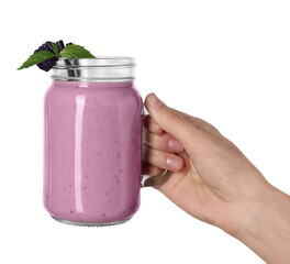 Woman with mason jar of delicious blackberry smoothie on white background, closeup